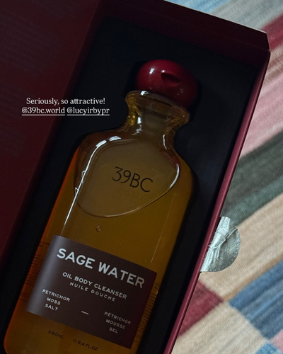 39BC Sage Water Bath & Shower Oil in its open box on a patterned surface